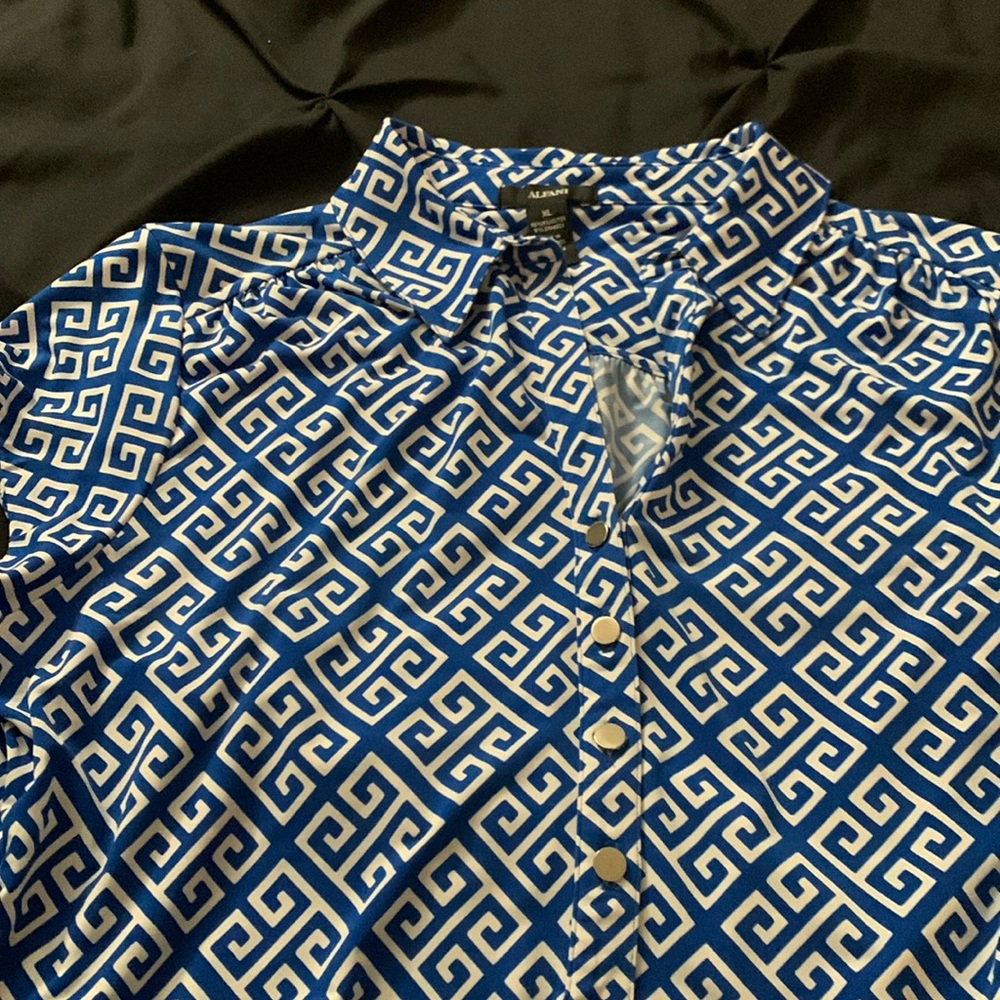 Short sleeve with snaps. Gently worn.